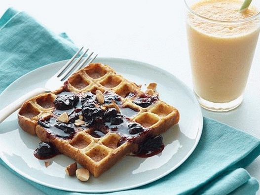 French toast in a waffle iron with blueberry sauce and carrot-ginger smoothie