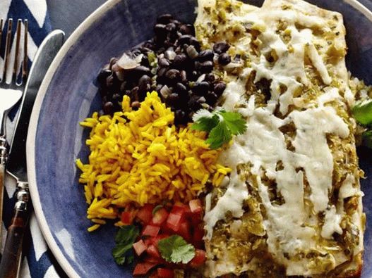 Enchiladas with chicken and a side dish of yellow rice and black beans