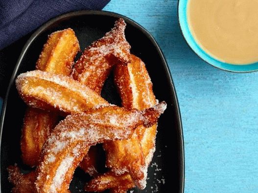 Churros with coconut sauce (donuts from custard dough)