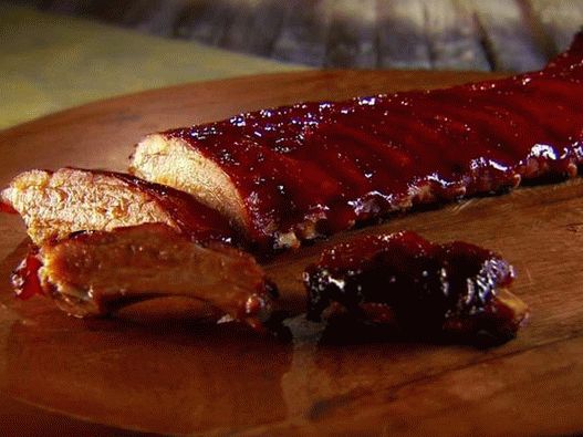 Pork ribs with spicy plum barbecue sauce in the oven