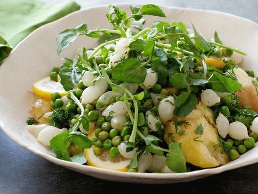 Young potatoes with green peas, lemon and pearl onions