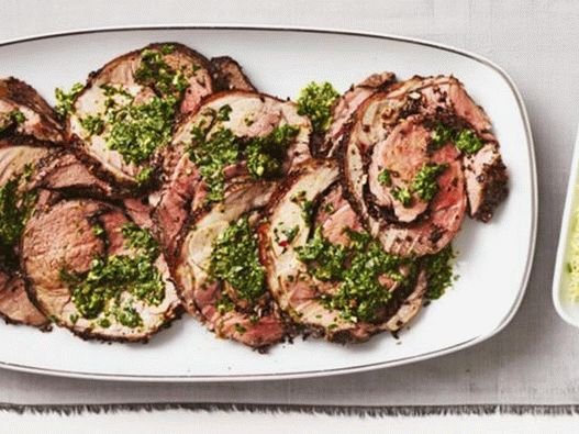 Lamb meat roll stuffed with olives with salsa verde