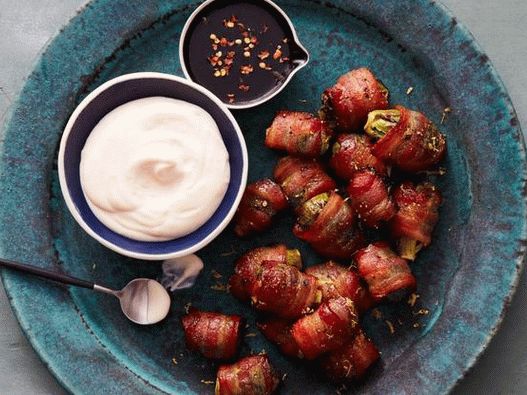 Brussels sprouts wrapped in bacon with lemon sauce