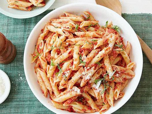 Photo of penne pasta with dried tomato pesto sauce