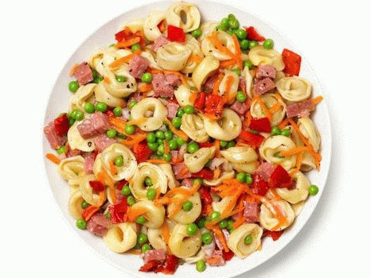 Salad with tortellini pasta, sausage, carrots, green peas and baked pepper
