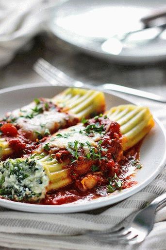 Photo of Manicotti in tomato sauce stuffed with ricotta, spinach and bacon