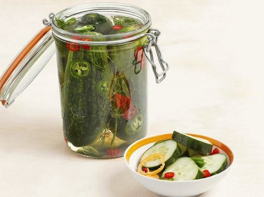 Photo pickled cucumbers with chili peppers