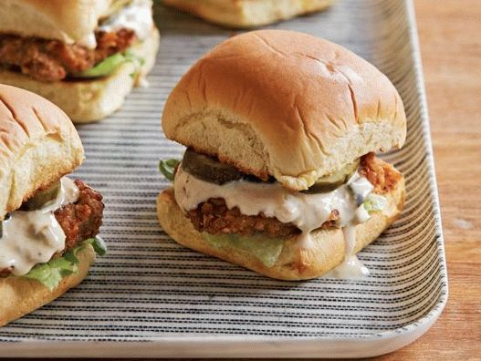 Photo Mini-sandwiches with pork tenderloin breaded from pretzels with mustard