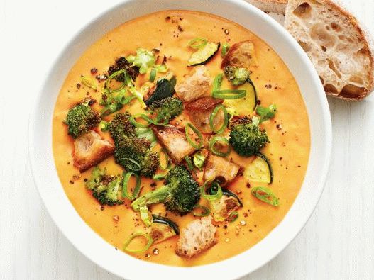 Photo Carrot-ginger soup puree of baked vegetables
