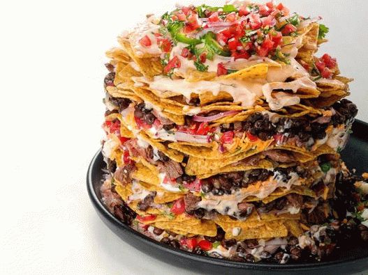 Photo of Nachos with beef, black beans and cheese sauce
