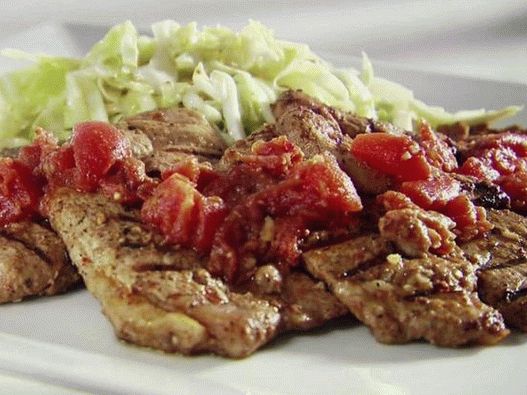 Photo Natural pork cutlets on the grill in the tex-mex style