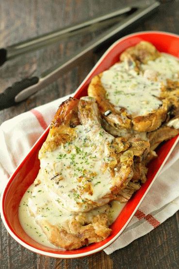 Photo of a breaded hunting schnitzel with mushroom sauce