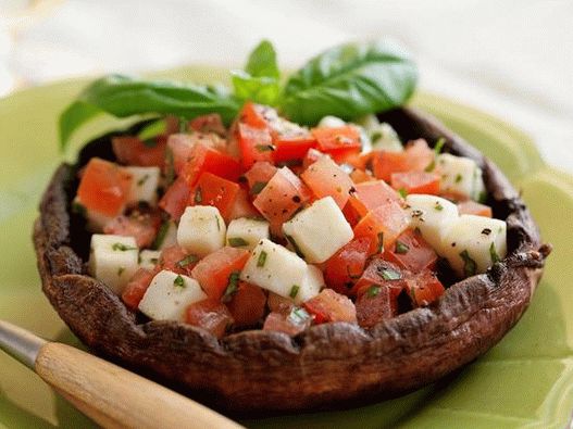 Caprese salad in mushroom caps on the grill