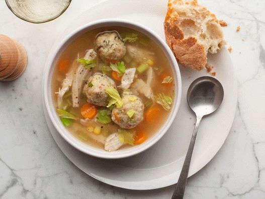 Photo Vegetable soup with turkey and dumplings