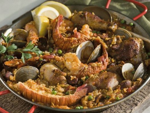 Photo of Paella with seafood, chicken and chorizo