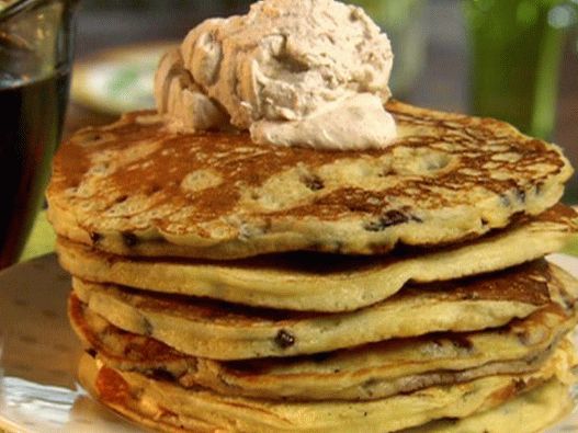 Photo of Pancake in milk with chocolate chips and whipped cream with cinnamon
