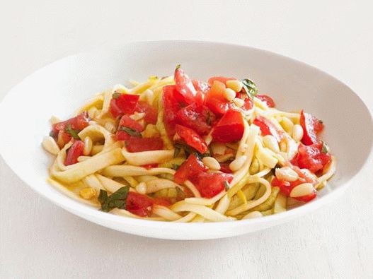 Photo of Pasta Fettuccine from fresh zucchini with spicy tomato sauce with slices