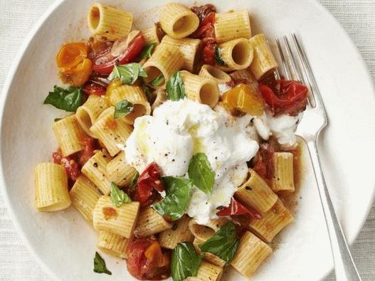Photo of rigatoni pasta with baked cherry tomatoes and burrata cheese
