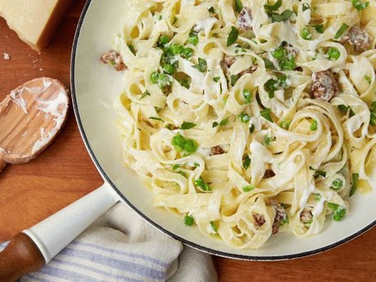 Photo of tagliatelle pasta with Italian sausage in cheese sauce