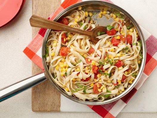Photo of Tagliatelle pasta with corn and cherry tomatoes