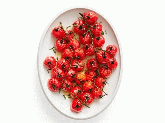 Photo of baked tomatoes on a branch