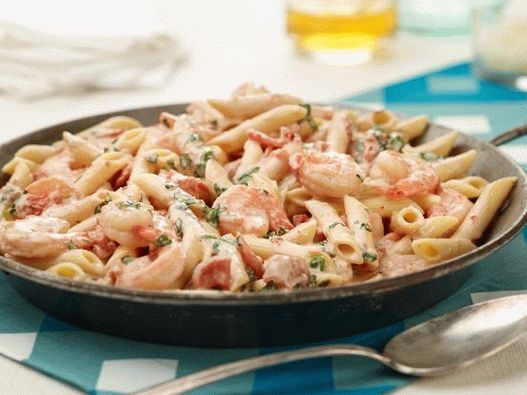 Photo of Penne with shrimp and creamy sauce with herbs