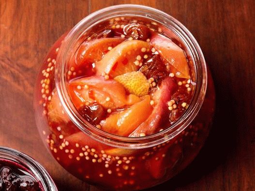 Photo of a peach compote with mustard seeds