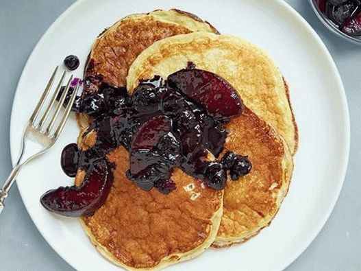 Photo of Lush pancakes on yogurt with blueberry and peach sauce
