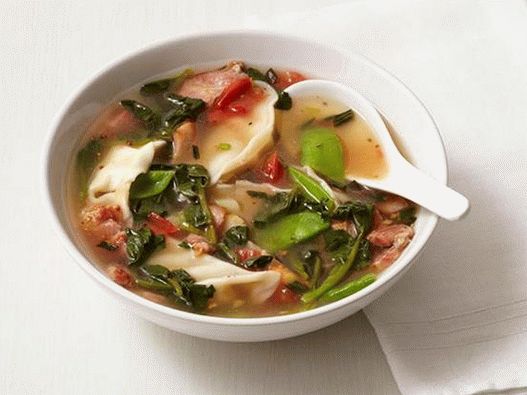 Soup with dumplings, bacon and sugar peas