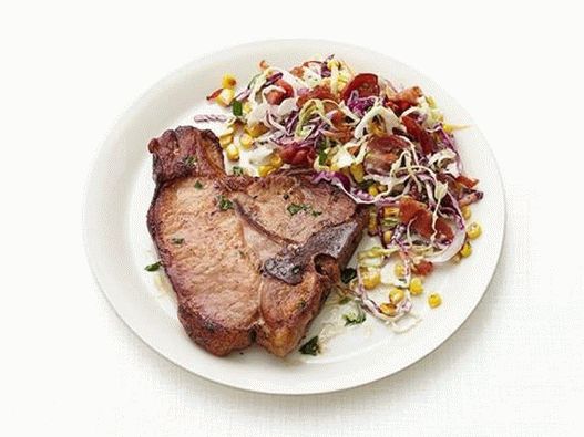 Pork cutlet and cabbage salad with bacon and corn