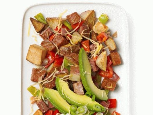 Photo of fried boiled potatoes with corned beef