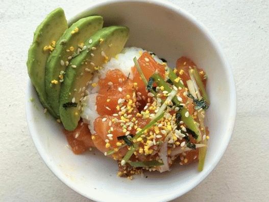 Bowl of rice and poke with salmon and avocado