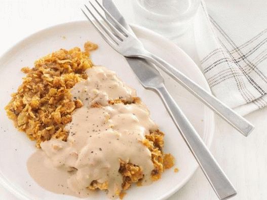 Beef chop in breadcrumbs with corn flakes and cream sauce