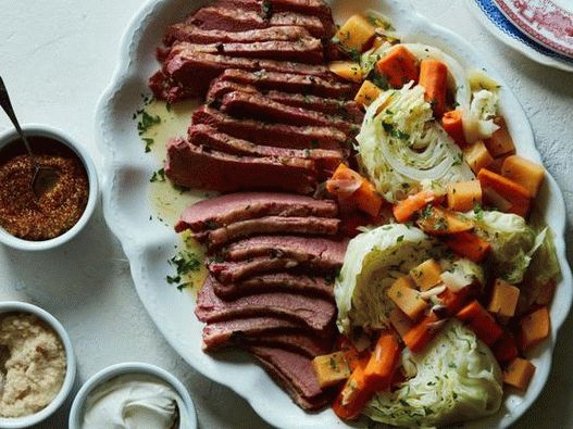 Photo of Beef stew with cabbage and root vegetables in a slow cooker