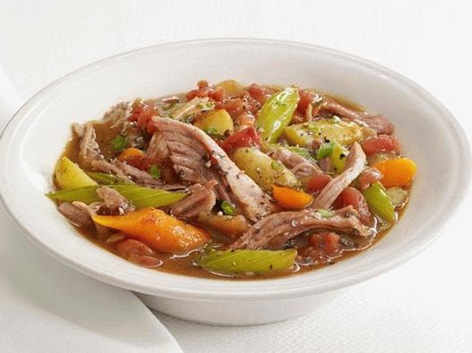 Photo of pork stew in a slow cooker