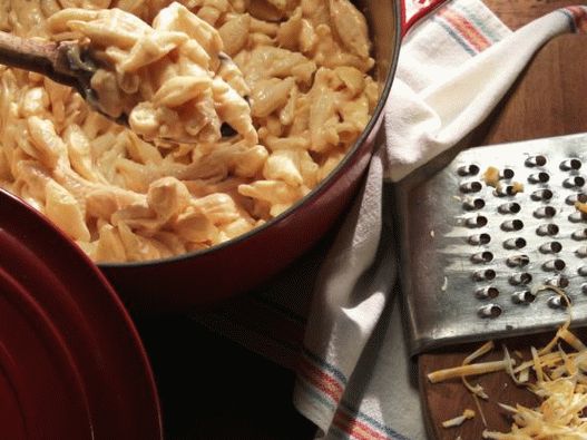 Photo of Seashells in a cheese sauce in a pan