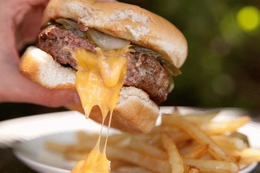 Burgers with cutlets with cheese inside with spicy ketchup