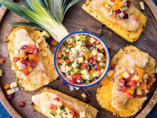 Photo - Fish on a grilled pineapple substrate with spicy salsa