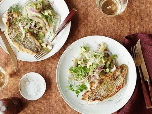 Sea bass fried in a pan and relish of physalis, avocado and fennel