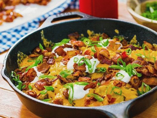 Photo of the dish - Grilled potatoes with cheese and sour cream, fried in a pan