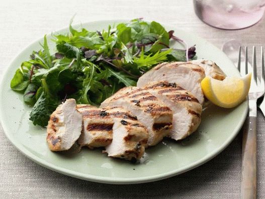 Herb marinated chicken breast fried in a pan