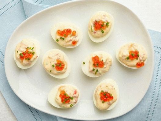 Eggs stuffed with smoked salmon and caviar