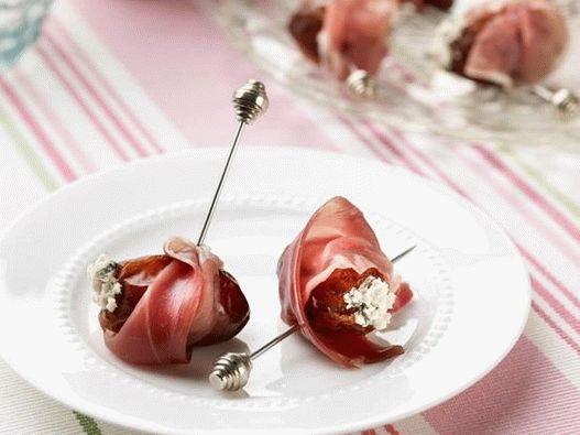 Dates stuffed with cheese, wrapped in prosciutto