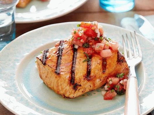 Grilled salmon in a glaze of sherry vinegar and honey with spicy tomato sauce