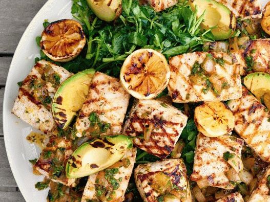 Photo of a grilled swordfish with salsa verde