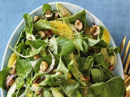 Photo Salad of avocado, watercress and oranges