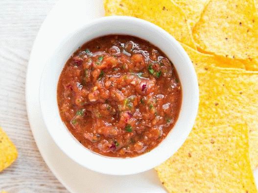 Photo of salsa with baked tomatoes in a blender
