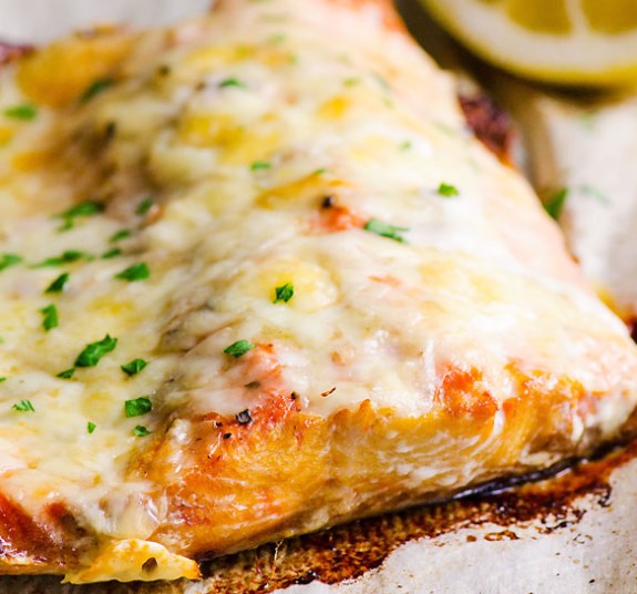 Salmon under cheese in the oven