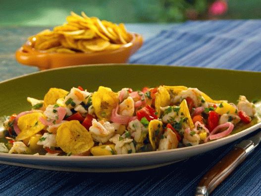 Photo of Ceviche from sea bass and shrimp with serrano pepper, mango, smoked tomatoes and crispy banana chips