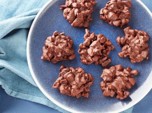 Photo Chocolate candies with dried cherries and almonds